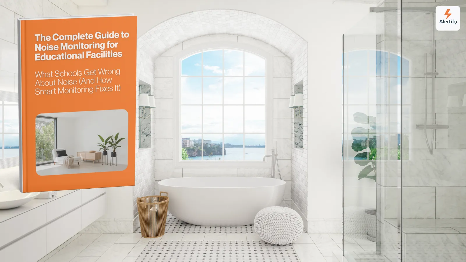 Una guida Alertify mostrata come libro stampato, in piedi sul lavabo di un bagno luminoso rivestito in marmo, con vasca freestanding e vista mare.
